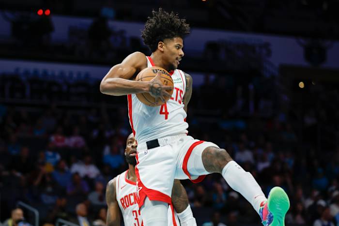 Rockets guard Jalen Green (4) pulls down a rebound against the Charlotte Hornets during the first quarter at Spectrum Center.